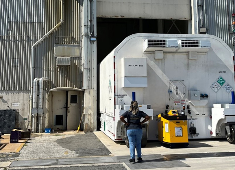 woman standing in front of J3 during transport