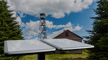 antenna in front of cabin and tower