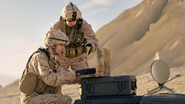 two soldiers on laptop