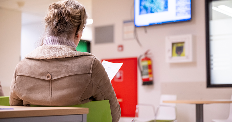 woman waiting in government office