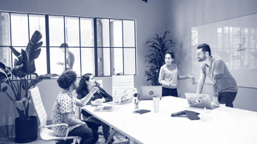 people working in conference room