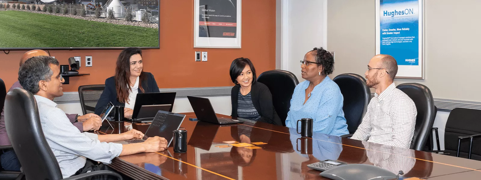 Employees sitting around conference room