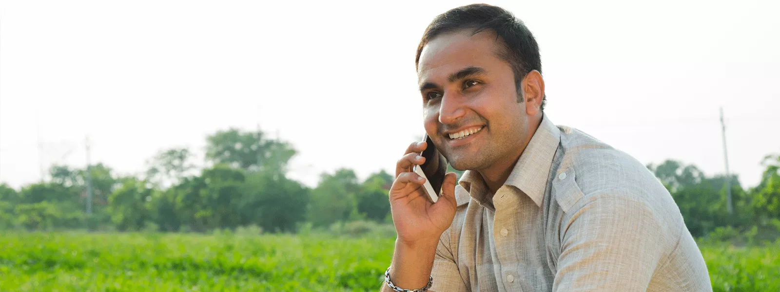 Man using cell phone in rural area