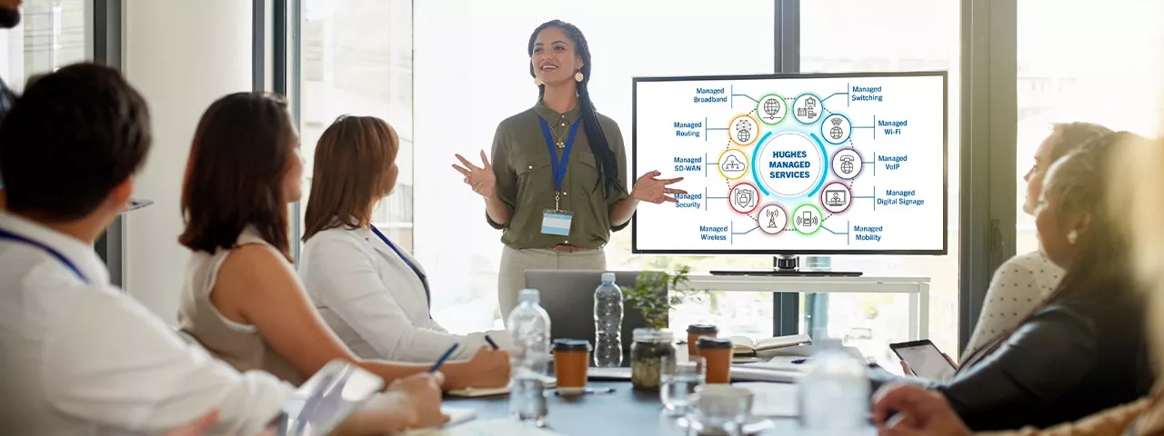 woman presenting to colleagues