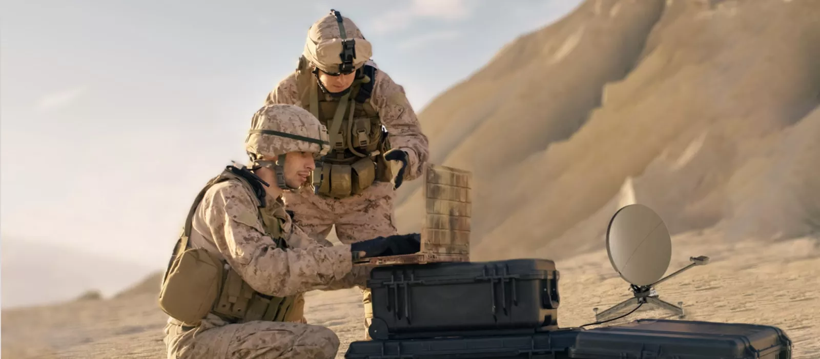 two soldiers on laptop