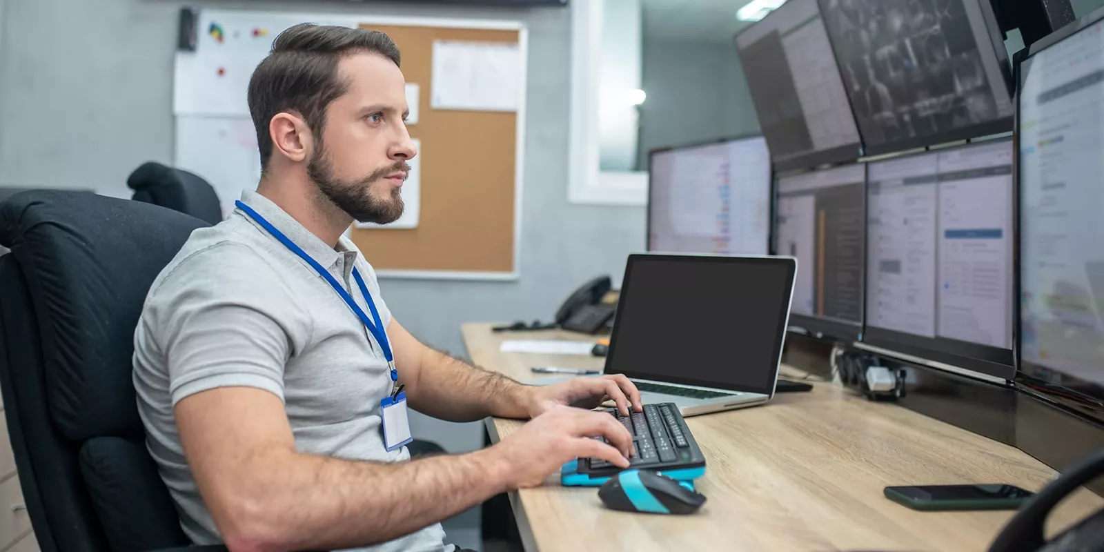 man sitting at computer