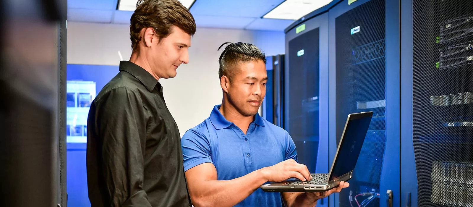 Hughes employees in server room