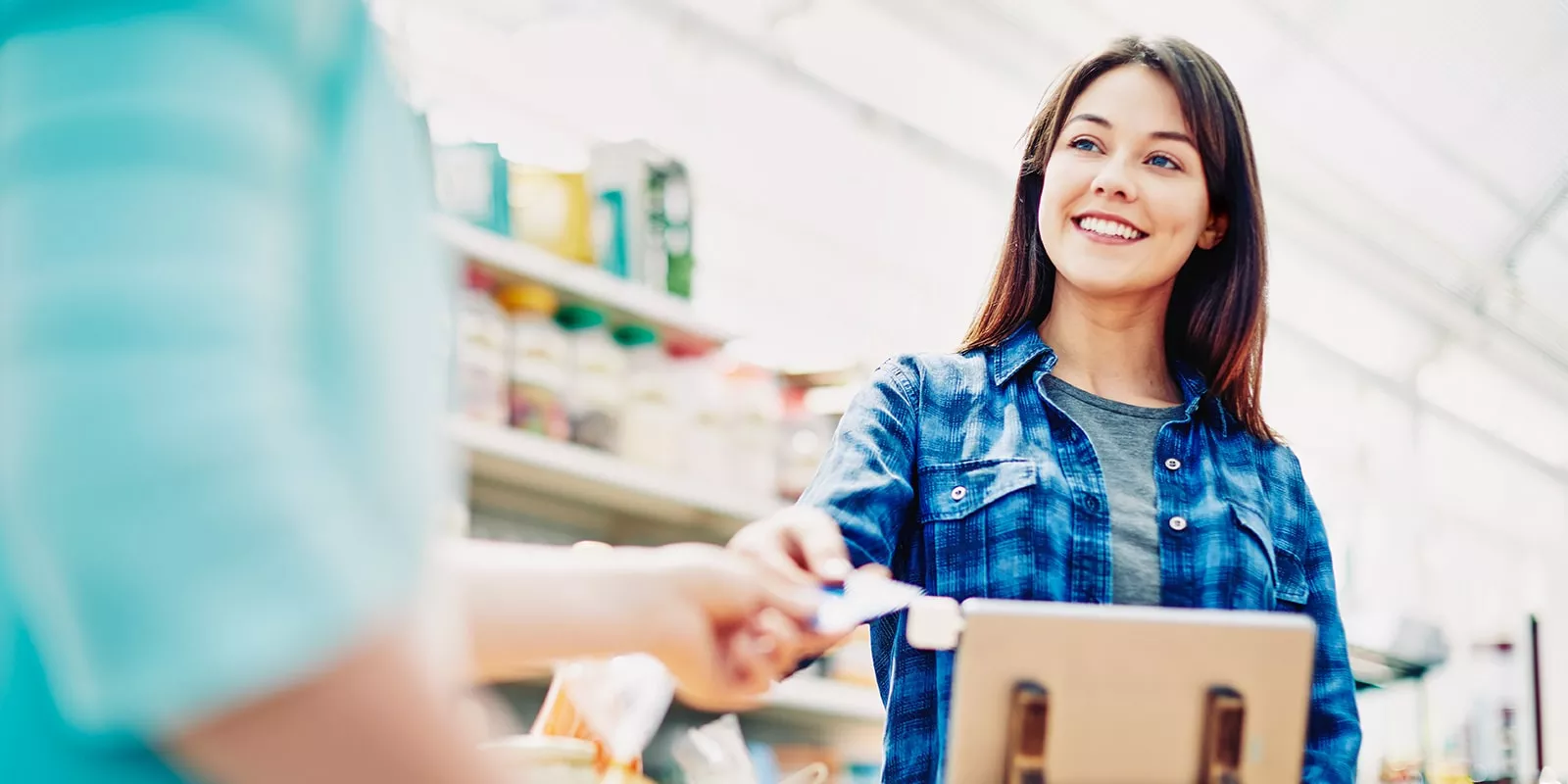 woman at cashier in store