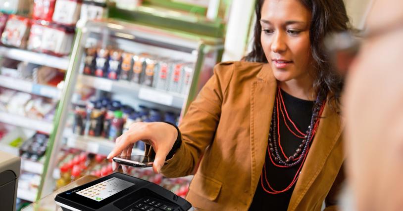 woman paying at checkout