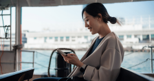 Woman using device on ferry