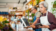 employee at wireless POS machine